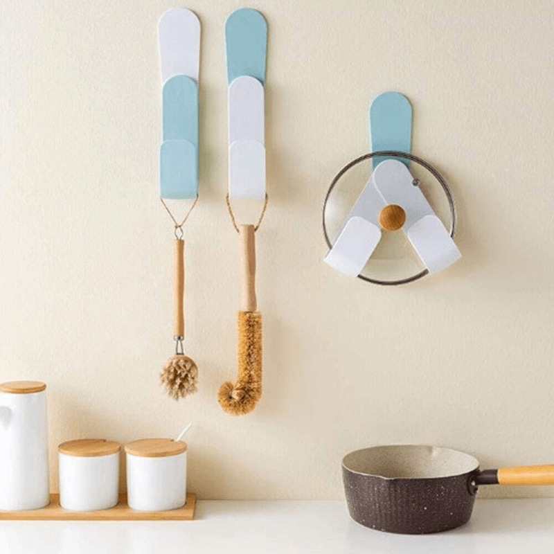 Self adhesive pot lid holder