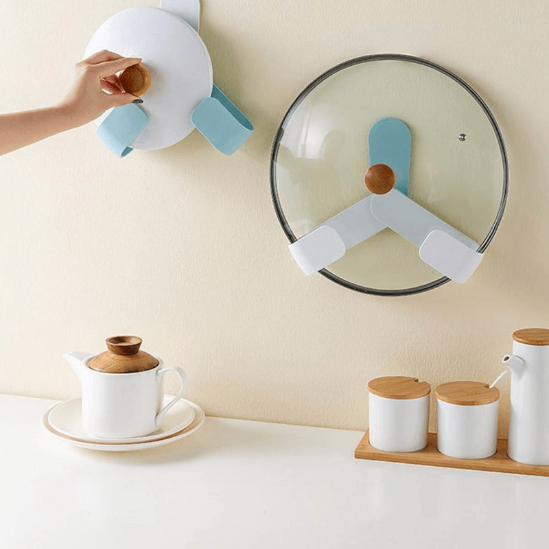 Self adhesive pot lid holder