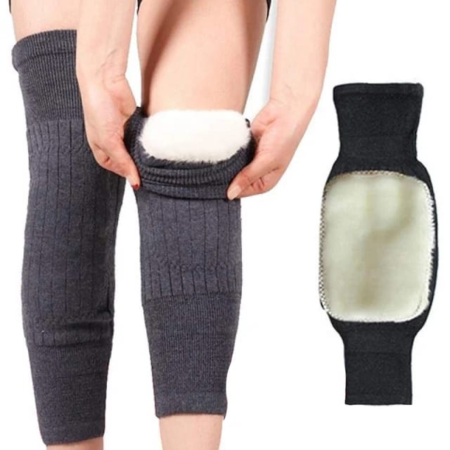 Gray knee-high socks with fur accents worn by a person on a white background2